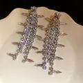 Exquisite silver-tone long fringe earrings with sparkling rhinestone inlays on a ceramic plate - Tassel Style (HE32915) / Silver