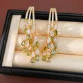 Detail of 18k gold plated drop earrings with green and white pear-shaped zircons - 18K Gold Plated (HE34037) / Gold-Green