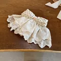 Elegant lace hair clip with a polka-dot bow, a delicate hair accessory for women. - Spring Clips / White