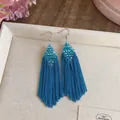 Elegant blue beaded tassel earrings featuring a diamond shape and stylish chain fringe design. - Blue
