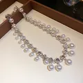 Detailed view of luxury rhinestone and faux pearl tassel choker necklace with silver finish - Necklace / Silver