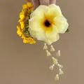 Close-up detail of a bright yellow flower hair clip with elegant floral tassels and beads - Duckbill Hair Clips / Single Piece / Yellow