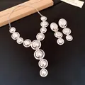 Detailed view of silver-toned smooth round metal jewelry set with necklace and earrings - Necklace and Earrings Set / Silver