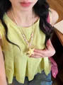 Close-up of a colorful starfish beaded necklace worn on a beach vacation style outfit - Necklace (HN11603) / Pink-White