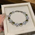 Elegant olive green zircon flower bracelet with sparkling oval crystals in silver finish - Silver Bracelet / Olive Green