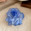 Detailed view of a blue gradient fabric mesh flower hair clip with layered petals. - Duckbill Hair Clips / Blue