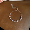 Elegant silver adjustable bracelet featuring pink pearls and zircon flower charms. - 56# Bracelet Four Rhinestone Flower Slider Style / Silver Pink