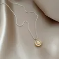 Close-up of eight-pointed star necklace with sparkling zircon on satin fabric. - Eight-Pointed Star Style (HN12588) / Gold and Silver