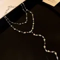 Elegante collana a Y a doppio strato con cuori e strass su un lussuoso sfondo nero opaco - Collana (Stile 2) / Argento