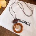 Long vintage ethnic style necklace with adjustable cord and wooden ring pendant. - Ring Pendant Style (HN12226) / Brown