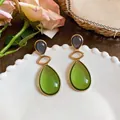 Elegant green resin teardrop earrings with gold-tone finish for women - Purple and Green (Gold Frame)