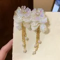 Elegant white floral tassel earrings with gold chains and hanging pearls for women - Steel Post (HE31735-1) / White