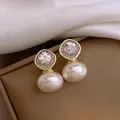 Elegant oval pearl stud earrings with sparkling diamond-shaped zircon accents - Silver Post-Oval Pearl(HE25935) / Gold