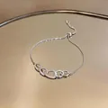 Dettaglio macro bracciale a maglie in zircone argento con chiusura scorrevole regolabile - Anello Ovale Scorrimento / Argento