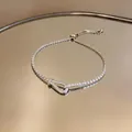 Elegante bracciale con fibbia a ferro di cavallo, zirconi e catena a trazione regolabile - Fibbia Ferro Cavallo Scorrimento / Argento
