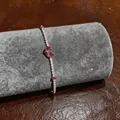 Close-up of French luxury zircon bracelet with red heart stones on jewelry roll - Butterfly Bracelet (1)