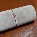 Detailed view of elegant silver bracelet with pink clover and sparkling zircons - Four-Leaf Clover Bracelet (2)