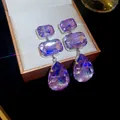 Detail showing the sparkle of purple crystal teardrop and geometric dangle earrings - Silver Earring Post Geometric Water Drop Tassel Style (23#)