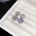 Elegant silver needle double flower earrings with sparkling cubic zirconia in a jewelry box - Hollow Four-leaf Clover Flower Style / Silver