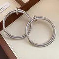 Detailed view showing the intricate pleated texture of vintage silver hoop earrings - Pleated Round Style / Silver