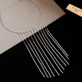 Elegant metallic chain fringe choker necklace featuring a waterfall of long silver tassels. - Silver