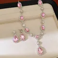 Elegant jewelry set featuring a pink rhinestone teardrop necklace and matching earrings - Necklace and Stud Earrings / Pink