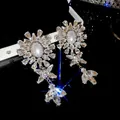 Luxury geometric tassel earrings with sparkling teardrop crystals in silver finish. - Snowflake Radiant Geometric Tassel Style (73)