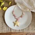 Collana di perline con stella marina in ceramica fatta a mano per vacanze - Rosa-Bianco