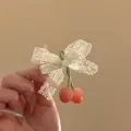 Close-up of pastoral lace bow hair clip with cute pink cherry charms for women - White Pink Bow Cherry Style (HH9857-1) / 1 Piece
