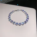 Detailed macro shot of sparkling zircon tennis bracelet with high-shine finish - Silver-Blue
