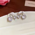 Close-up of elegant cherry stud earrings with sparkling cubic zirconia - Cherry Shaped Stud Earrings (HE31852) / White