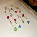 Close-up detail of vibrant multi-color faceted glass beads on long elegant silver chains - Earrings Only (Without Necklace) / Colorful