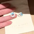 Close-up detail of Korean style pearl and light blue heart gemstone stud earrings on card - Garland Heart Stud Earrings (3#) / Silver-Blue