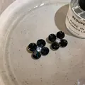Elegant black floral stud earrings with a sparkling crystal center stone for women - Black