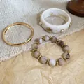 Detailed view of the vintage three-piece bracelet set with resin and golden metallic finish - 75# Bangle (3-Piece Set)