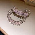 Detailed close-up showing pink zircon floral patterns on these C-shaped earrings - C-Shaped Flower (Silver Post) / Pink