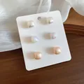 Set of three geometric pearl stud earrings in iridescent, pink and white finishes. - 6 Pairs Set / Multicolor
