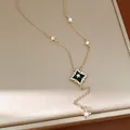 Detailed close-up view of an elegant gold necklace with zircon rhombus star pendant - Light Coffee Gold