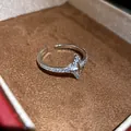 Detailed macro view of a star-shaped zircon pavé open ring inside a luxury brown velvet jewelry box - Four-Pointed Star Style (2) / Silver