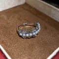 Close-up detail of a minimalist silver hollow open ring with pearls and sparkling zircons - Pearl Hollow Style (3) / Silver