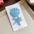 Close-up of blue resin shell and starfish hair clips with glitter and pearls - 海星和贝壳套装 / Two-Piece Set / Blue