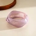 Macro detail of a purple irregular geometric resin bangle with smooth translucent finish - Purple