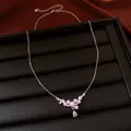 Detailed close-up view of elegant pink pearl and waterdrop zircon pendant on silver necklace - Pink