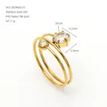 Detail of golden 18K gold plated stainless steel spiral ring with clear zircons. - Clear Round Style (ZR2463G-01) / Open Ring