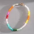 Vibrant multi-color acrylic beaded necklace with gold spring clasp on grey texture - Necklace-Multicolor Type 3