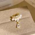 Elegant gold-tone ear cuff featuring pearls and a sparkling water-drop zircon pendant - Single Piece / Gold