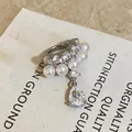 Elegant silver-tone ear cuff featuring white pearls and a sparkling teardrop cubic zirconia dangle - Single Piece / Silver