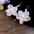 Close-up view of elegant pink chiffon flower earrings featuring pearls and long tassels. - Ear Hooks (Pink)