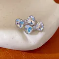 Close-up of crystal bow-shaped open ring featuring faceted heart stones - Open Ring (HR3601) / Phantom Color (Silver)