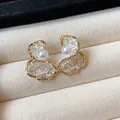 Close-up of 18K gold-plated floral pearl stud earrings with intricate lace details - Style 3 / Gold